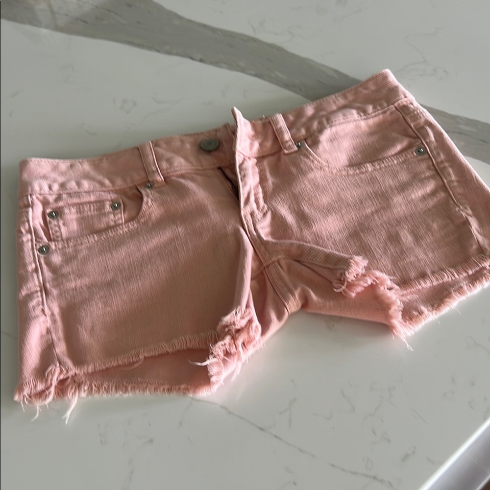VINTAGE!! 2011 low rise -American Eagle Outfitters Pink Jean Shorts Frayed Hem